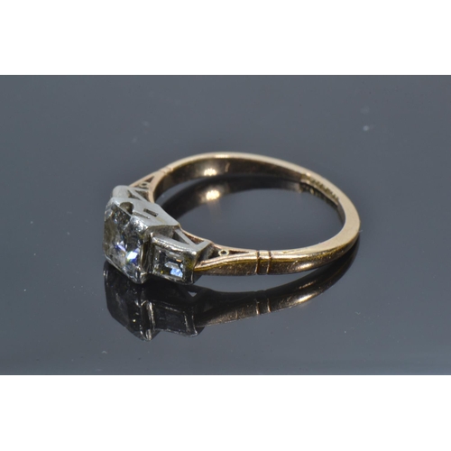 72A - 18ct gold, platinum & emerald-cut diamond trilogy ring, the centre stone weighing approximately ... 