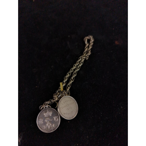 216 - White metal chain with plated T-bar & clip, suspending two HM silver fob medals, gross weight 33... 