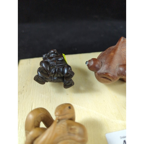 424 - 3 netsuke (all signed) & carved goldfish 15cm long.