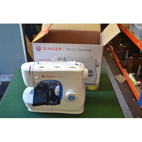 316 - Singer M320L Serenade electric sewing machine, in box. Appears in good order.