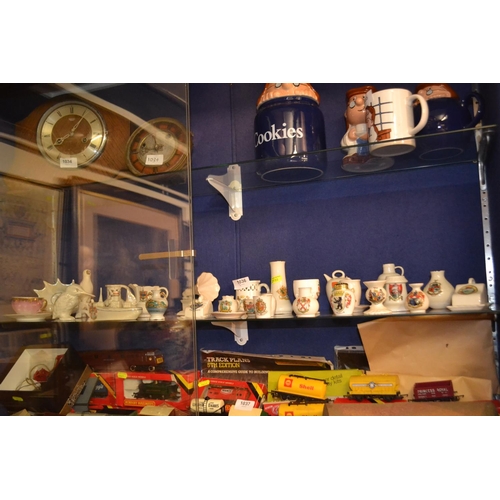 1036 - Shelf full of mostly crested ware items, various makers