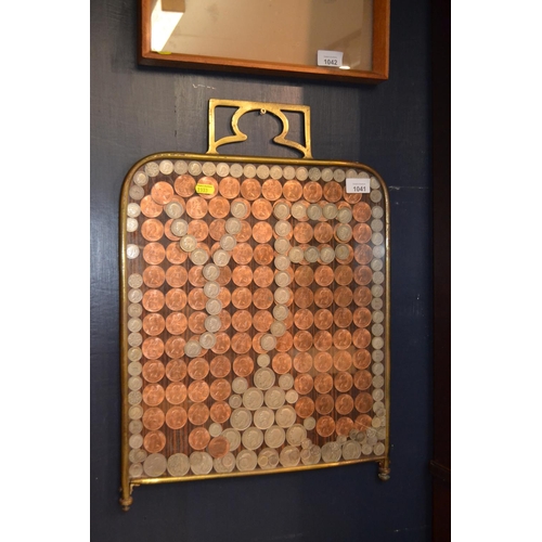 1041 - Fire screen with silver and copper coins mounted behind glass in a brass frame. Small crack to glass... 