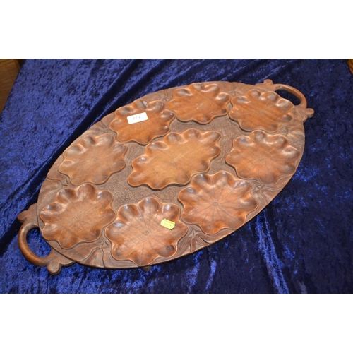 779 - Carved wooden serving tray. Length 59.5 cm.