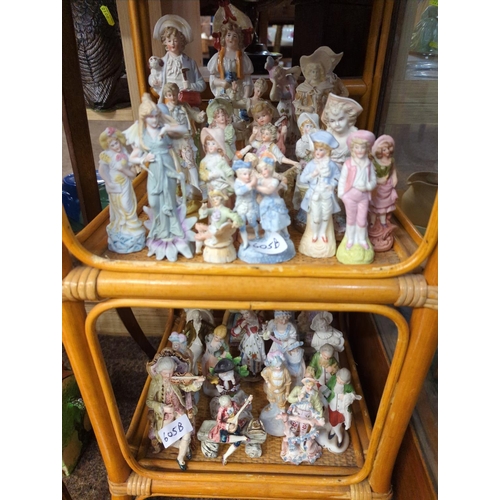 605B - Collection of ceramics over four shelves, including a large quantity of continental figures some AF,... 