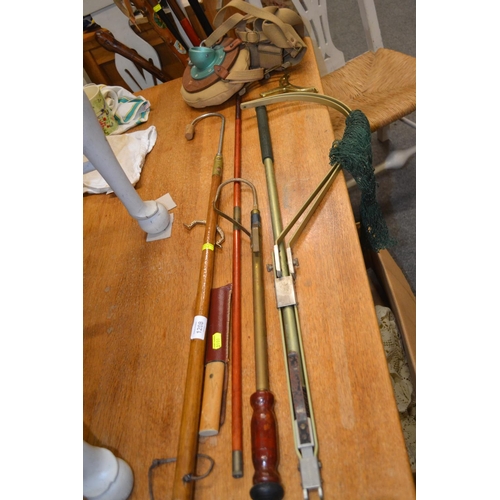 1208 - Assorted vintage fishing equipment, Gaffs, knives, and fishing rod holster.