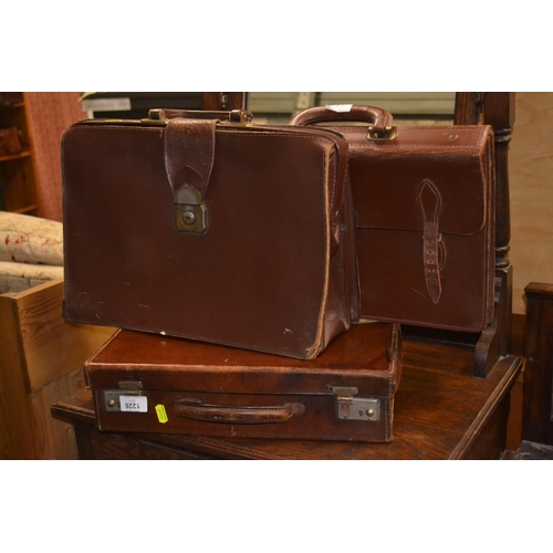 1226 - Three leather cases inc. monogrammed 'W.L.B' briefcase