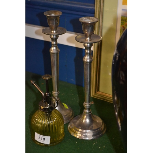 318 - Two large candlesticks, height 27cm, and a plant mister