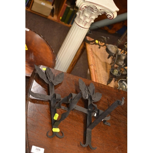 340 - Two cast iron wall brackets with antelope head, height 30cm