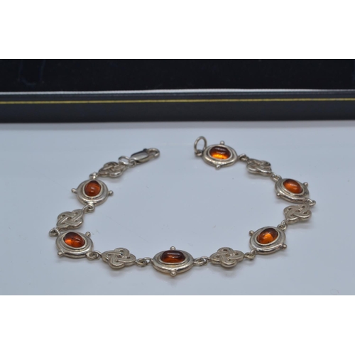 444 - 925 silver & amber bracelet, with Celtic knots, length 200mm, 14.18 grams