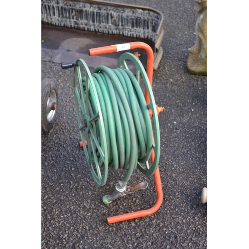 63 - Polyguard hose reel with hose