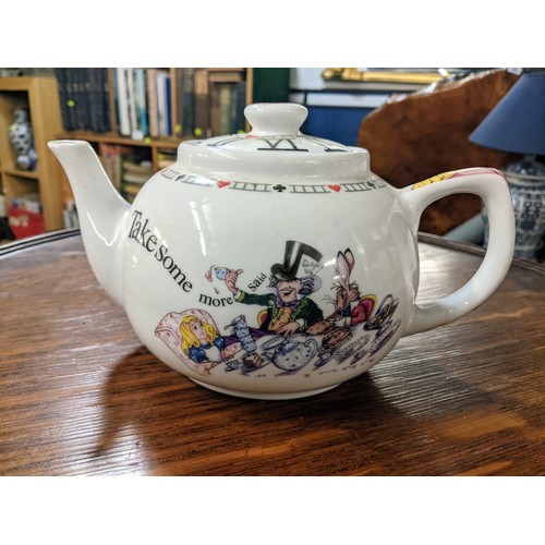 377 - Alice in Wonderland teapot and four mugs by Paul Cardew