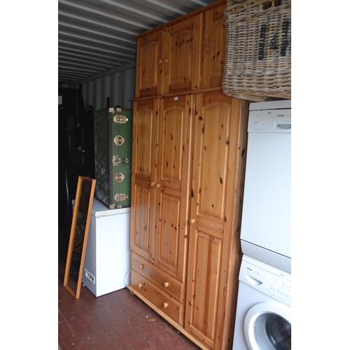 295 - Three door pine wardrobe with two lower drawers, 116cm wide, 53cm deep, 181cm high, together a match... 