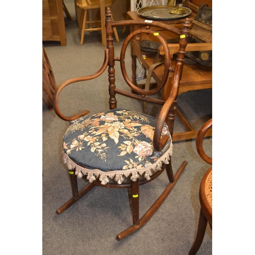 873 - Bentwood rocking chair with upholstered seat