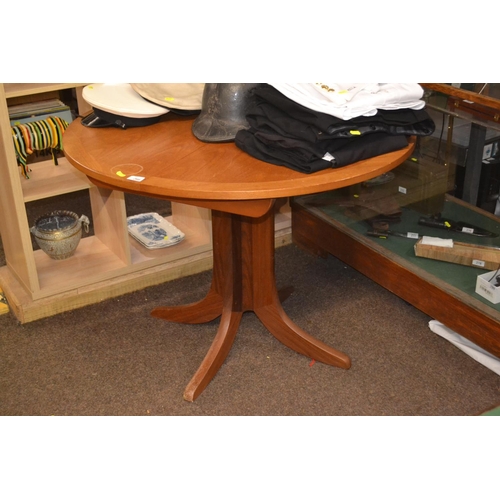 266 - Circular extending teak table. D1m (unextended). Water damage to top.