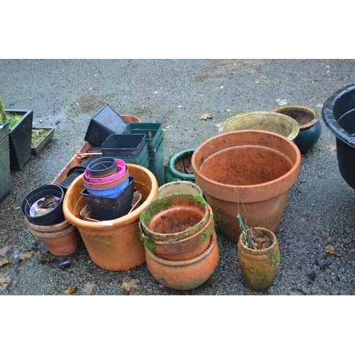 29 - Quantity of terracotta & glazed pots etc