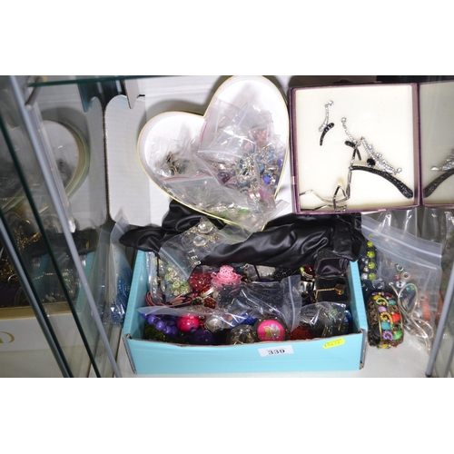 339 - Large selection of costume jewellery on bottom shelf