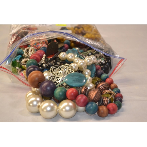 363 - Bag of costume necklaces in bag