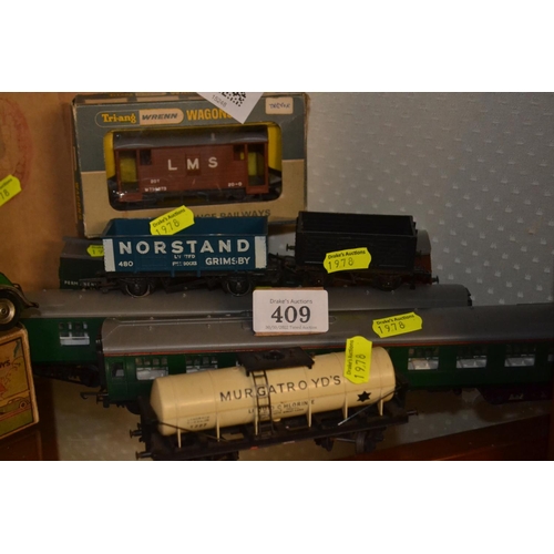 409 - Collection of Tri-ang 00 gauge model railway rolling stock. 8 individual stock items.