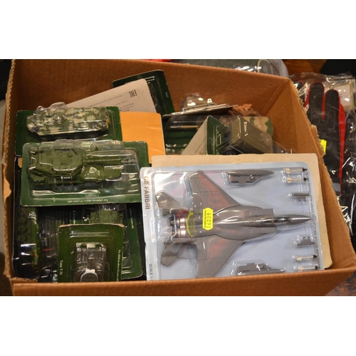 424 - Boxed military vehicles