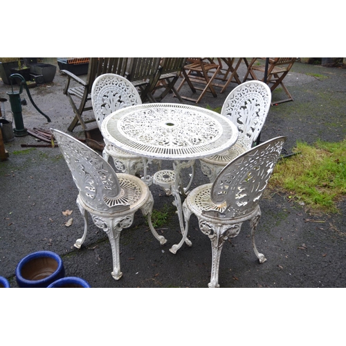 44 - Cast aluminium bistro table & 4 chairs. Table D80cm