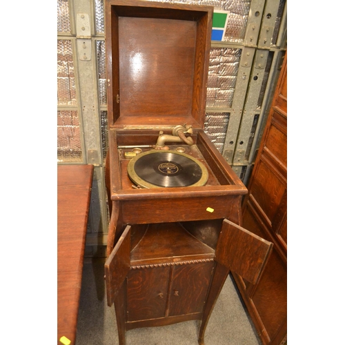 635 - Oak cased gramophone W46cm D55cm H105cm. Internal shelves missing.