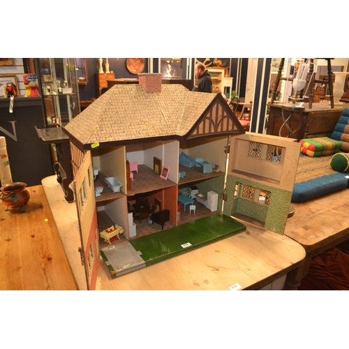 638 - Tudor style dolls house, with mid-century style contents. H65cm W65cm