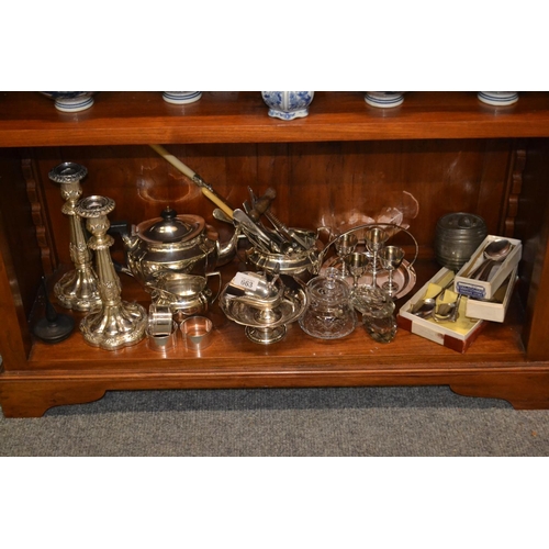 663 - Large shelf of silver plated items, inc. candle sticks, egg cups etc