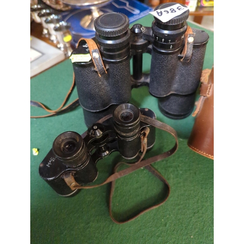 386A - 2 x pairs of binoculars Wray 8x30 and Regent 10x50's.