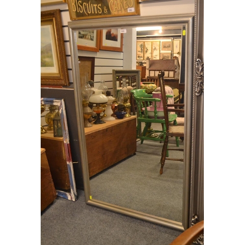 300 - Large silver framed rectangular mirror. 138cm x 87cm