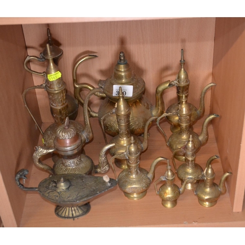 330 - Collection of brass ewers and an oil lamp