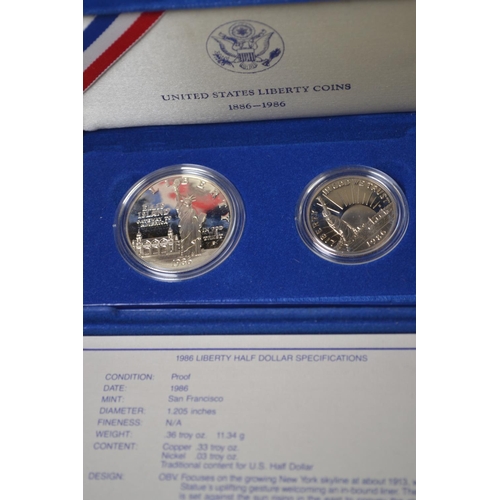 411 - Cased US 1986 Liberty silver dollar & half dollar set