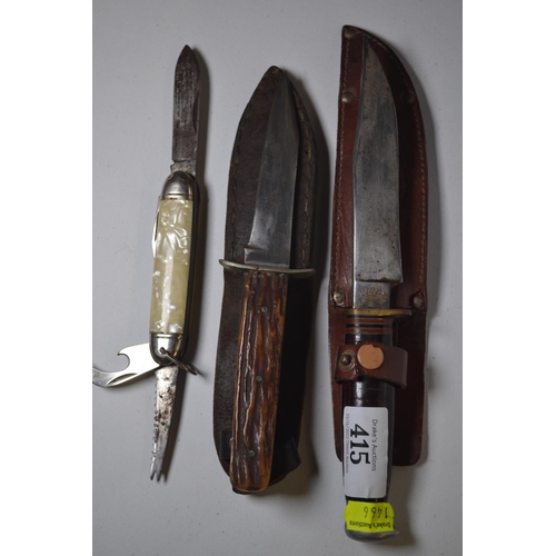 415 - Two hunting knives in leather sheaths, including Kirkham & J Hall, together with a pen knife