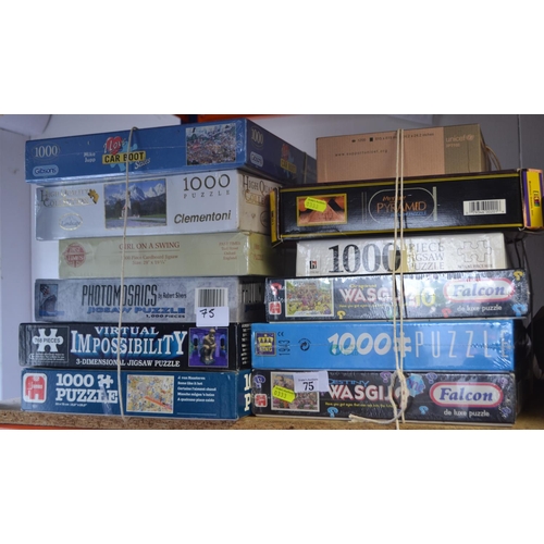 75 - 12 jigsaw puzzles, some new & unopened.