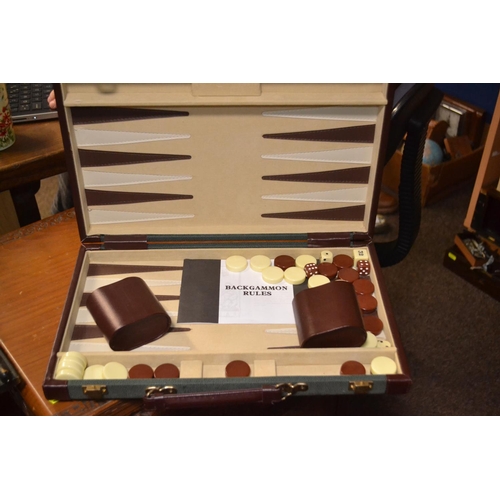 399 - Cased backgammon set in good condition.