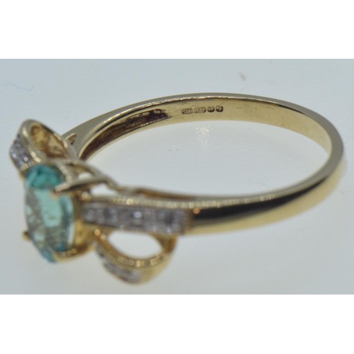 12 - 9ct gold, topaz & diamond 'bow' ring, hallmarked Birmingham, size N1/2, 2.1 grams