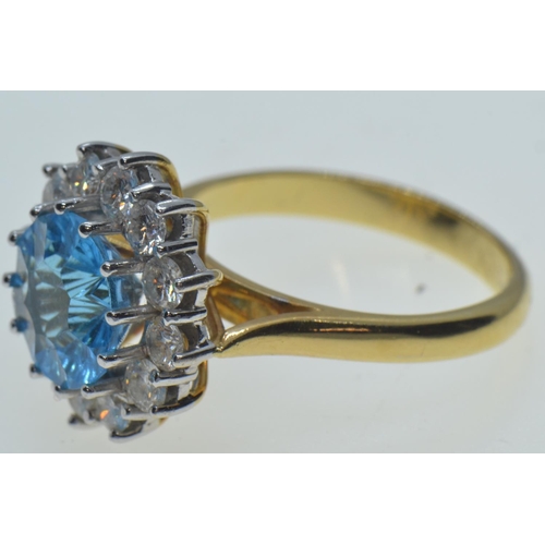 38 - 18ct gold, blue topaz & diamond cluster ring, size N, 6.63 grams