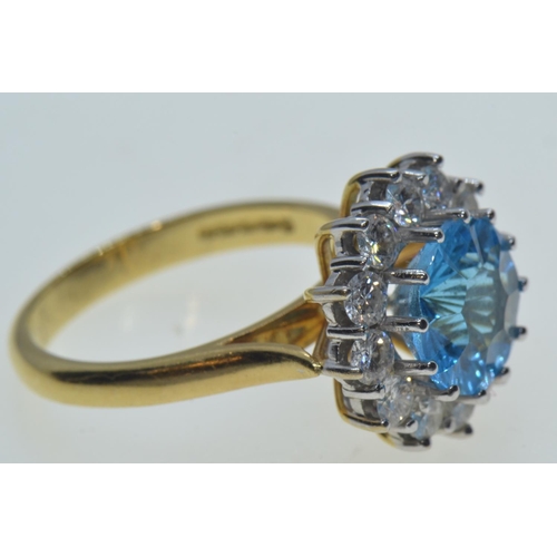 38 - 18ct gold, blue topaz & diamond cluster ring, size N, 6.63 grams