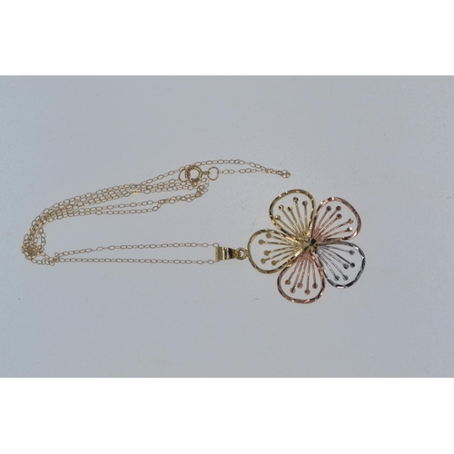 46 - 9ct tri-colour gold open work flower pendant with a 10ct gold chain, pendant length including bale 3... 