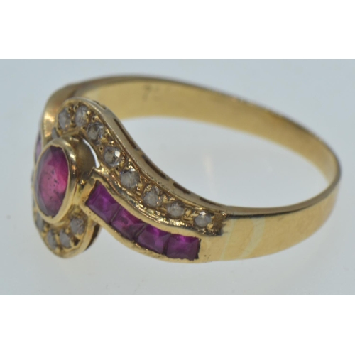 47 - 18ct gold, ruby & diamond crossover ring, the central bezel-set ruby measuring approximately 5.5... 