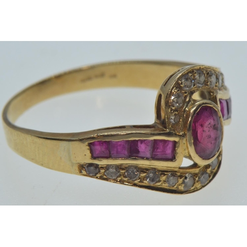 47 - 18ct gold, ruby & diamond crossover ring, the central bezel-set ruby measuring approximately 5.5... 