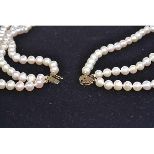 57 - Triple strand cultured pearl necklace with a 14ct gold clasp, pearls measure approximately between 5... 