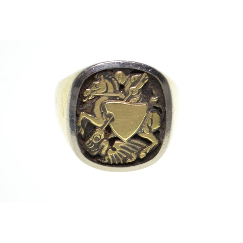 61 - 18ct gold signet ring, set to the top with St. George defeating the dragon, size V, 18.85 grams