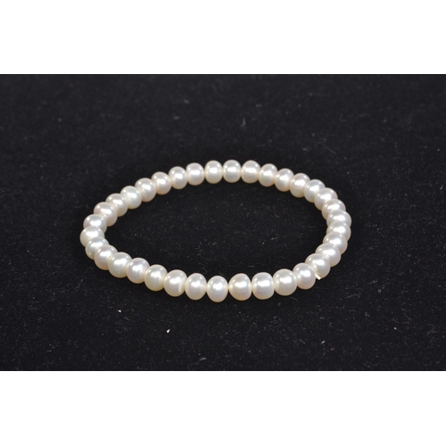 80 - Cultured pearl necklace with a yellow metal clasp, circumference 230mm; a bracelet, approximately 90... 