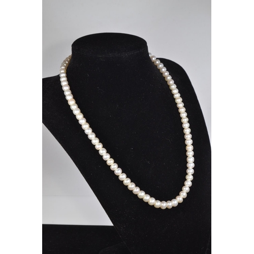 80 - Cultured pearl necklace with a yellow metal clasp, circumference 230mm; a bracelet, approximately 90... 