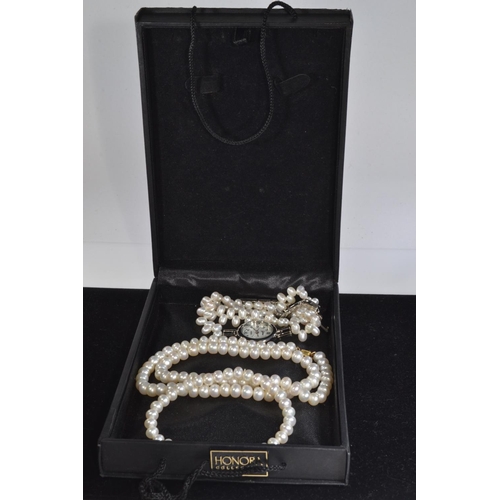 80 - Cultured pearl necklace with a yellow metal clasp, circumference 230mm; a bracelet, approximately 90... 