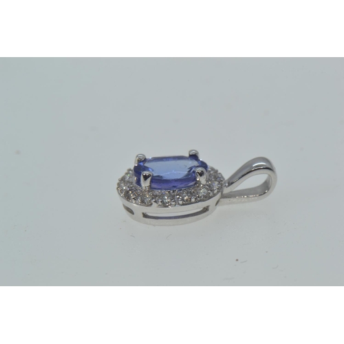 88 - 18ct white gold cluster pendant set with diamonds surrounding a central blue stone, possibly kyanite... 