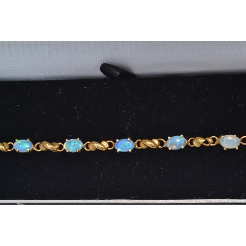 91 - 9ct gold & opal bracelet, circumference 190mm, gross weight 5.2 grams