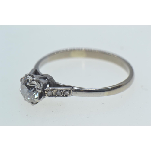 98 - Diamond ring, centring a claw-set brilliant-cut diamond weighing approximately 0.75 carat, betw... 