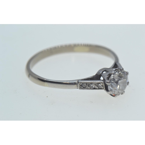 98 - Diamond ring, centring a claw-set brilliant-cut diamond weighing approximately 0.75 carat, betw... 