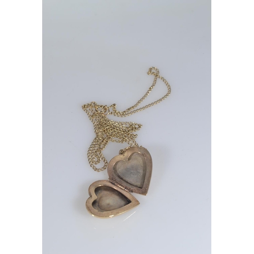 110 - 9ct gold heart-shaped locket, 3.9 grams, & a yellow metal chain, 2.8 grams